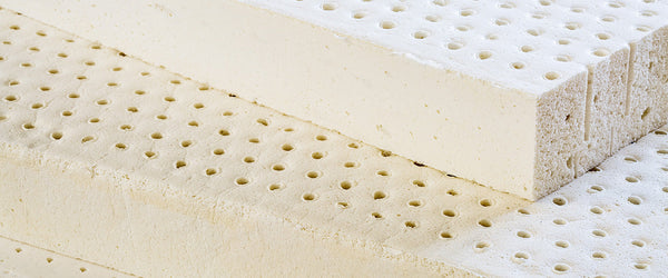 Sheets of perforated latex foam for mattresses