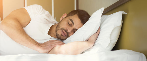 Man with back pain sleeping on his side